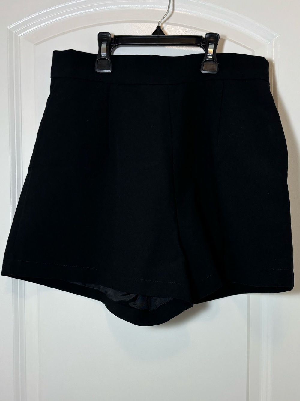 Umi White Hang Tag on Black Garment #172